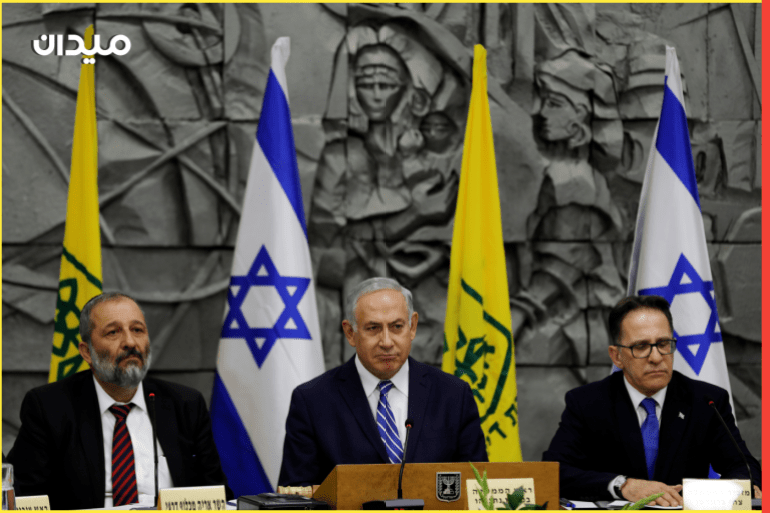Israeli Prime Minister Benjamin Netanyahu (C), Cabinet Secretary Tzachi Braverman (R), and Israeli Interior Minister Aryeh Deri attend the weekly cabinet meeting, convened at the Dimona municipality building in southern Israel, March 20, 2018. REUTERS/Ronen Zvulun