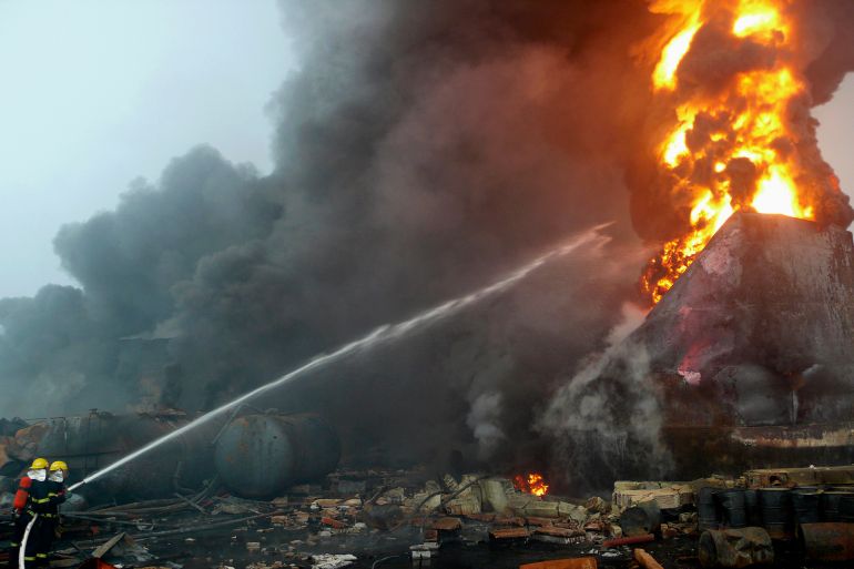 Fightfighters try to put out a fire at a chemical plant in Yanshi, Henan province July 15, 2009. A chemical plant explosion in central China's Henan Province early Wednesday has killed a factory worker and hospitalized 108 others, Xinhua News Agency reported. REUTERS/Carlf Zhang (CHINA DISASTER)