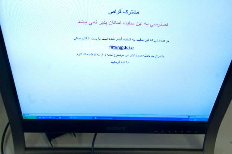 EDITORS' NOTE: Reuters and other foreign media are subject to Iranian restrictions on their ability to film or take pictures in Tehran. An Internet user tries to log onto social networking site Facebook in Tehran in this May 25, 2009 file photo. The Farsi text reads "Dear Customer, access to this site is not possible. In the event that this site has been mistakenly filtered please email filter@dci.ir with the name of the domain and any other necessary explanation." Internet messages have been circulating about possible rallies on February 11, 2010, when Iran marks the 31st anniversary of the Islamic revolution. But the climate in the Islamic Republic is much harder than before last year's post-election protests. To match feature IRAN/REVOLUTION-INTERNET REUTERS/Morteza Nikoubazl (IRAN BUSINESS - Tags: POLITICS SCI TECH ELECTIONS)
