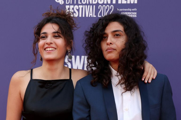 French-Lebanese actor Manal Issa (R) and French actor Nathalie Issa pose on the red carpet upon arrival to attend the Special presentation of the movie "The Swimmers", during the 2022 BFI London Film Festival in London on October 9, 2022.