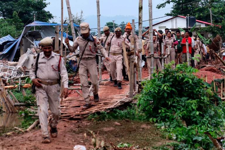 District administration officials demolish illegally constructed house during an eviction drive, at Borbari in Guwahati, India Friday, May 13, 2022. (Photo by: David Talukdar/UCG/Universal Images Group via Getty Images)