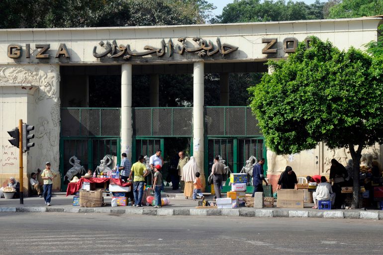 Visitors stand in front of the entrance to the Giza Zoo in C EGYPT - MAY 22: Visitors stand in front of the entrance to the Giza Zoo in Cairo, Egypt, on Thursday, May 22, 2008. The Giza Zoo, once considered among the world's best exhibits of African animal life, is part of a litany of complaints against President Hosni Mubarak from traffic-clogged streets to crumbling public schools, hospitals and transportation. (Photo by Dana Smillie/Bloomberg via Getty Images)