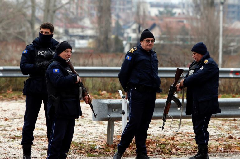 Kosovo police officers patrol in North Mitrovica