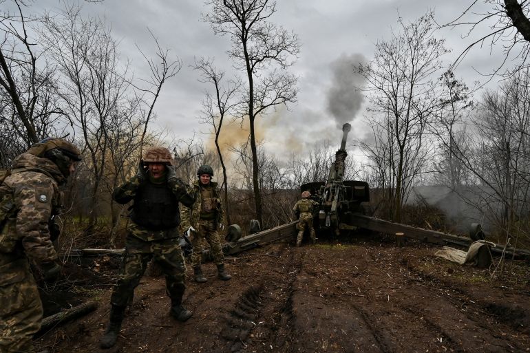 Ukrainian servicemen fire with a 2A65 Msta-B howitzer towards Russian troops in a frontline in Zaporizhzhia region