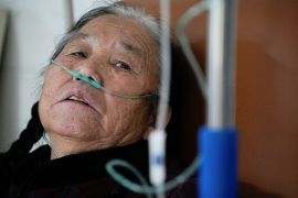 Weng Shuiye receives oxygen at a hospital, amid COVID-19 outbreak, at a village in Tonglu county