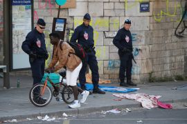 French police evict thousands of migrants living on sidewalks near the reception center for migrants and refugees at porte de la Chapelle, north of Paris