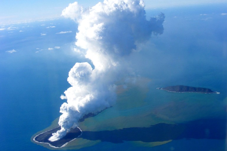 This picture taken on March 19, 2009 sho This picture taken on March 19, 2009 shows an aerial photo of ash rising into the air from an undersea volcanic eruption, part of the uninbabited islet of Hunga Ha'apai, 63 kilometres (39 miles) northwest of the Tongan capital Nuku'alofa. The volcano, which continued to spew on March 20 even as a major earthquake with a magnitude of 7.9 rocked Tonga's main island of Tongatapu, began erupting on March 16 several days after another more moderate earthquake. AFP PHOTO / Telusa Fotu / MATANGI TONGA (Photo credit should read Telusa Fotu/AFP via Getty Images) gettyimages-85525607