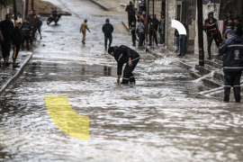 Heavy rain hits Gaza- - GAZA CITY, GAZA - DECEMBER 26: A man drains water on the flooded street after heavy rain in Gaza City, Gaza on December 26, 2022. The puddles caused by a lack of infrastructure made life difficult for the residents.
