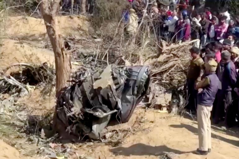 A general view of the debris of a crashed aircraft in Bharatpur, Rajasthan, India, January 28, 2023 in this screen grab obtained from a handout video. ANI/Handout via REUTERS THIS IMAGE HAS BEEN SUPPLIED BY A THIRD PARTY. INDIA OUT. NO COMMERCIAL OR EDITORIAL SALES IN INDIA.