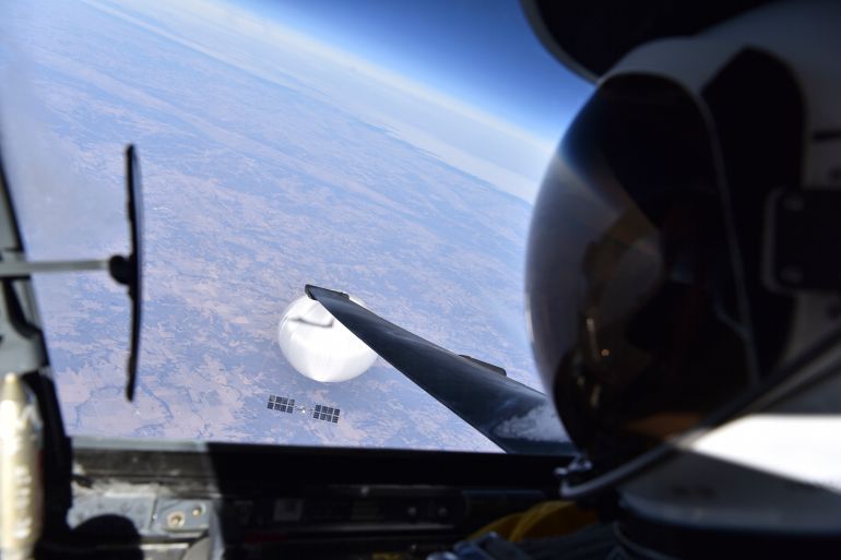 In this image released by the Department of Defense on Wednesday, Feb. 22, 2023, a U.S. Air Force U-2 pilot looks down at a suspected Chinese surveillance balloon as it hovers over the United States on Feb. 3, 2023. (Department of Defense via AP)