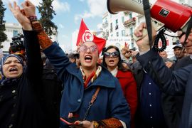 Tunisian activist Chaimaa Issa gestures during a protest against Tunisian President Kais Saied in Tunis