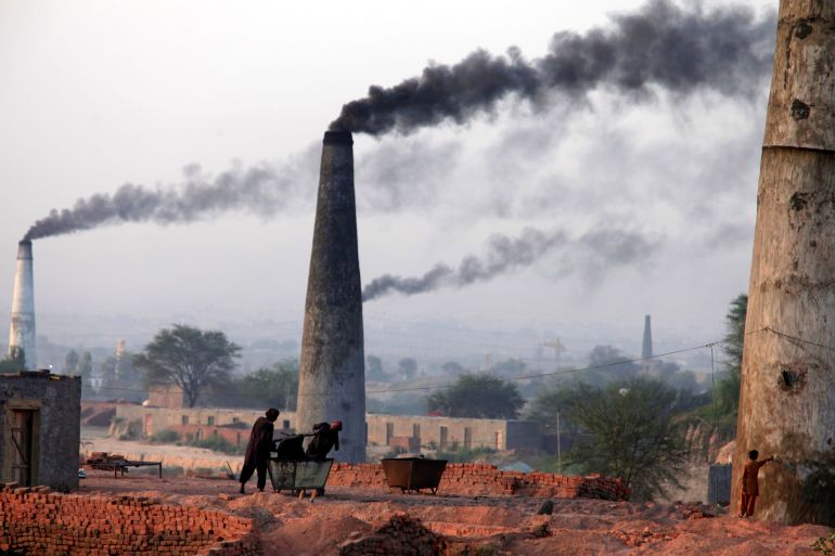 Smoke rises from the smoke stacks of brick factories on the outskirts of Islamabad