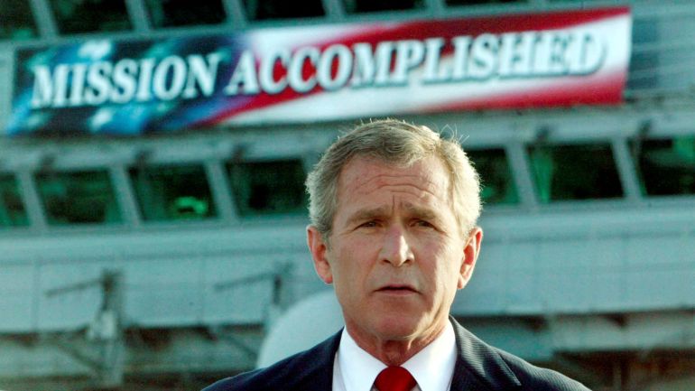 FILE PHOTO: The White House said on October 29, 2003 that it had helped with the production of a "Mission Accomplished" banner as a backdrop for President George W. Bush's speech onboard the USS Abraham Lincoln to declare combat operations over in Iraq. This file photo shows Bush delivering a speech to crew aboard the aircraft carrier USS Abraham Lincoln, as the carrier steamed toward San Diego, California on May 1, 2003. REUTERS/Larry Downing/FILE KL/GN/GAC/File Photo