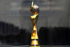 View of the FIFA Women's World Cup trophy in front of the Christ the Redeemer statue in Rio de Janeiro, Brazil on March 29, 2023. The Women's World Cup trophy was displayed as part of an international tour which has already included nine countries ahead of the 2023 Women's World Cup tournament in New Zealand and Australia, starting on July 20, 2023. (Photo by CARL DE SOUZA / AFP)