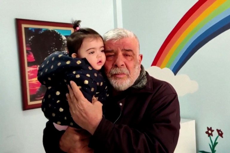 Trapped in rubble then separated, a Turkish man reunites with granddaughter