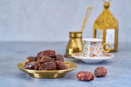 Dried dates fruit with Turkish coffee and Ramadan lantern - stock photo GettyImages-1472380980