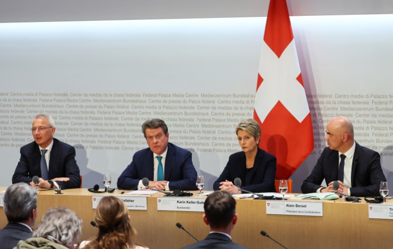 Chairman of the Board of Directors of Credit Suisse, Axel Lehmann, Chairman of the Board of Directors of UBS, Colm Kelleher, Federal Councillor and chief of the finance federal department Karin Keller-Sutter, and Swiss Federal Council (Bundesrat) President and chief of the interior federal department, Alain Berset attend a news conference on Credit Suisse after UBS takeover offer, in Bern, Switzerland, March 19, 2023. REUTERS/Denis Balibouse