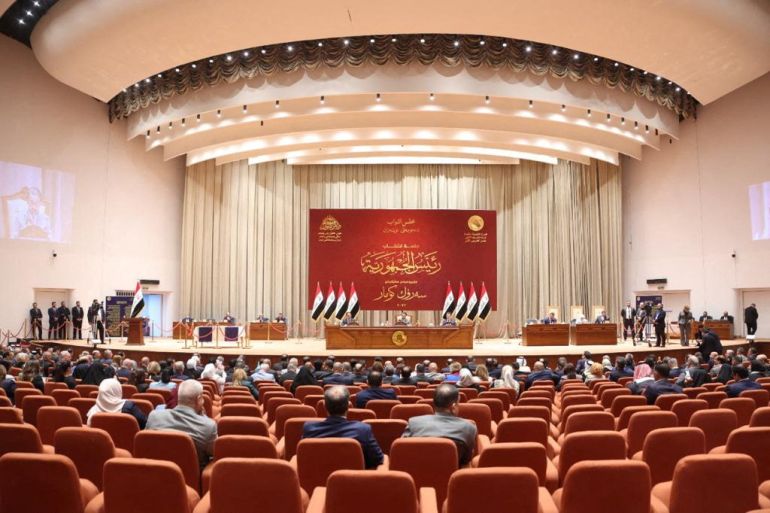 Iraqi lawmakers attend a parliamentary session to vote for a new head of state president in Baghdad