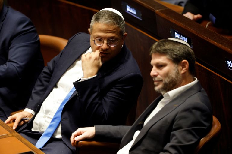 Right-wing Knesset members Itamar Ben-Gvir and Bezalel Smotrich attend a special session at the Knesset Israel's parliament, to approve and swear in a new right-wing government, in Jerusalem