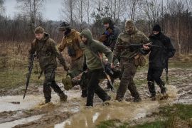 People take part in a military exercise for civilians near Lviv