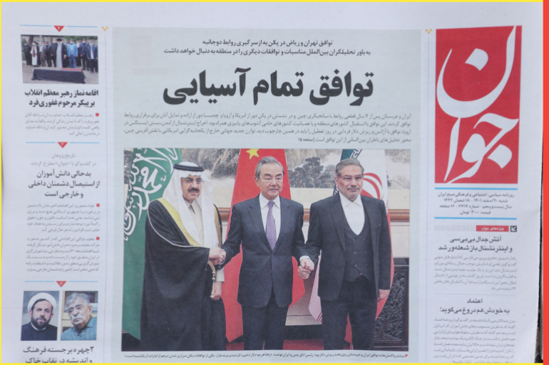 A newspaper with a cover picture of the Iranian Rear Admiral Ali Shamkhani, the secretary of the Supreme National Security Council and Saudi Minister of State and National Security Adviser Musaed bin Mohammed Al-Aiban, is seen in Tehran, Iran March 11, 2023. Majid Asgaripour/WANA (West Asia News Agency) via REUTERS ATTENTION EDITORS - THIS PICTURE WAS PROVIDED BY A THIRD PARTY