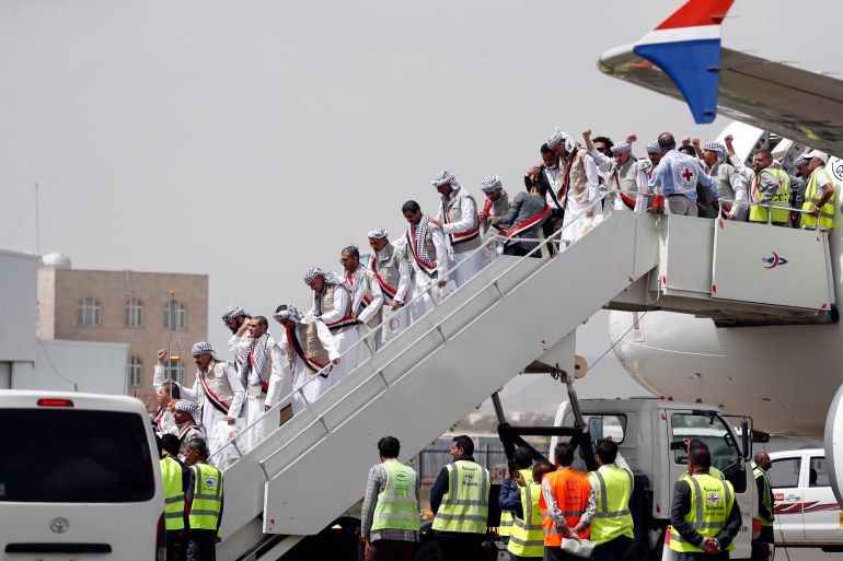 epa10573338 Freed Houthi prisoners disembark from an ICRC-chartered plane at Sana'a Airport on the second day of a prisoner swap in Sanaa, Yemen, 15 April 2023. Yemen's warring parties began on 14 April a three-day exchange of 887 prisoners. The Houthis have agreed to release 181 detainees, including Saudis and Sudanese soldiers who fought alongside Yemeni government forces, in exchange for 706 prisoners held by the Yemeni government, under the UN and ICRC-brokered prisoner swap deal reached last March in Switzerland. EPA-EFE/YAHYA ARHAB