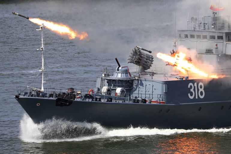 The Russian small anti-submarine ship Aleksin fires missiles during the Navy Day parade in Baltiysk