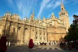 Seville,Spain-12 18 2015:The Seville Cathedral,a Gothic landmark with its Moorish style bell tower, known ...