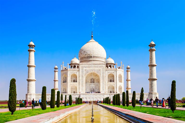 shutterstock_359122502 The Taj Mahal is a white marble mausoleum located in the city of Agra, India. Taj Mahal is one of Seven Wonders of the World.