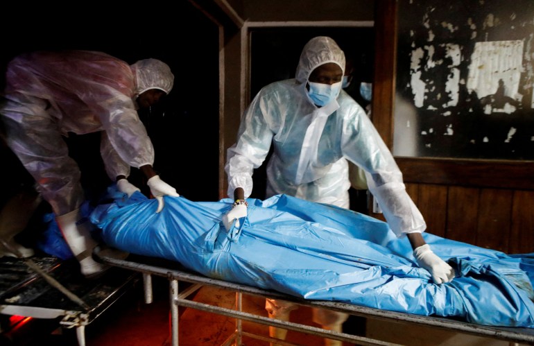 FILE PHOTO: Workers receive the exhumed bodies of followers of a Christian cult named "Good News International Church", who believed they would go to heaven, if they starved themselves to death in Shakahola, at the Malindi sub district hospital mortuary in Malindi, Kilifi county, Kenya April 27, 2023. REUTERS/Monicah Mwangi/File Photo