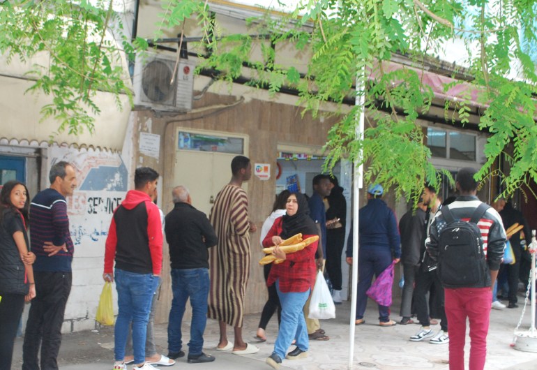 : Tunisian citizens queue up to buy bread in front of a bakery/Khadra neighborhood in May 2023