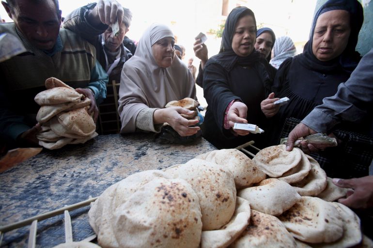 epa02277827 (FILE) A file photo dated 11 March 2008 of Egyptians stand in queue to purchase government subsidized bread at a bakery in Cairo, Egypt. Russia, one of the biggest wheat suppliers, decided to ban the export of wheat due to severe drought and wildfires. In a related development, the Egyptian General Authority for Supply Commodities, announced on 08 August 2010 that it had bought 240 thousand tons of French wheat to be shipped for the period 01 to 15 September 2010. Egypt's Minister of Social Solidarity, Dr. Ali Meselhi stated that Egypt has multiple sources to import wheat and it does not rely on one country and the rise in wheat prices in world markets will not affect the provision of subsidized bread to the Egyptian population. EPA/KHALED ELFIQI