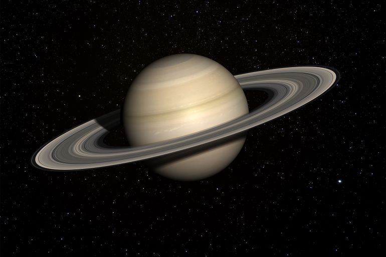 زحل يتقدم ليعتلي صدارة أكثر الكواكب امتلاكا للأقمار بإجمالي 145 قمرا. (غيتي) Saturn with stars in the background. - stock photo A 3D render made with "Blender" using publicly available textures from NASA: GettyImages-482675385