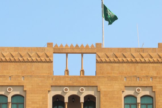 A Saudi flag flutters atop the Saudi Arabia's embassy in Beirut