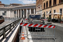 Aftermath of car breaking through barriers near the Vatican City