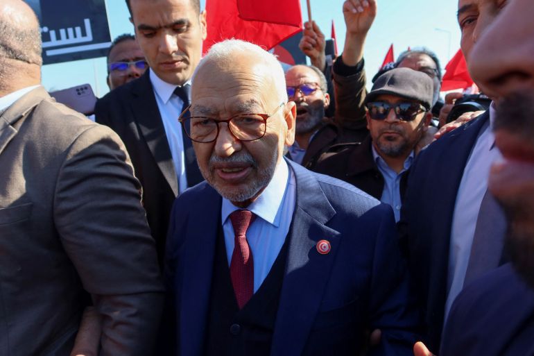 Rached Ghannouchi, head of the Islamist Ennahda party arrives at a court for questioning in Tunis