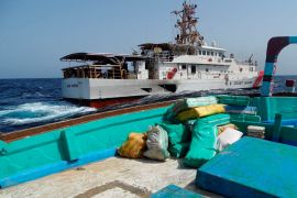 Bags of illegal drugs sit on the deck of a fishing vessel transiting international waters after departing Chah Bahar, Iran, seized by U.S. Coast Guard fast response cutter USCGC Glen Harris (WPC 1144), in the Gulf of Oman