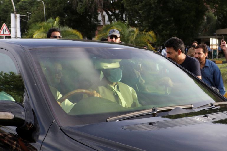 A vehicle carrying Pakistan's former Prime Minister Imran Khan arrives to the Supreme Court in Islamabad