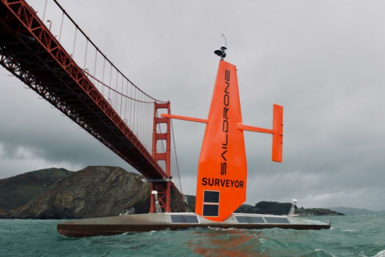 The autonomous Saildrone Surveyor sailing under the Golden Gate Bridge. Saildrone