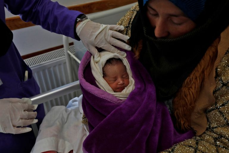 A trainee midwife examines a woman and her newborn baby at a hospital in Bamiyan, Afghanistan, March 2, 2023. A trainee midwife program has been spearheaded by the U.N. refugee agency (UNHCR) with a local NGO, where young women train for two years in the provincial capital hospital as midwives, after which they will return home to help the women in the community. "When the roads are blocked of course there are no means of transportation, people even use donkeys to move the patients to the clinic centres, but sometimes there is not even the opportunity for that," said Mohammad Ashraf Niazi, the head of UNHCR's Bamiyan office. "These students can help in each village, in each district with deliveries." REUTERS/Ali Khara SEARCH "KHARA MIDWIVES" FOR THIS STORY. SEARCH "WIDER IMAGE" FOR ALL STORIES.