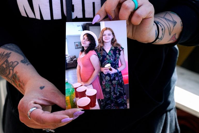 Ashleigh Webster shows a photo of her daughter Ivy Webster and her best friend Tiffany Guess, who were both murdered in Henryetta, Oklahoma, U.S. May 2, 2023. REUTERS/Nick Oxford REFILE - CORRECTING SPELLING OF THE NAME