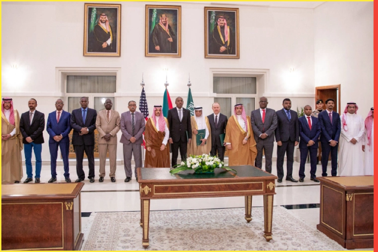 A handout picture provided by the Saudi Press Agency (SPA) on May 21, 2023, shows Saudi Foreign Minister Faisal bin Farhan (C), flanked by representatives of the Sudanese army and the rival Paramilitary Rapid Support forces, posing for a photograph after the signing of a ceasefire agreement in Jeddah. - With heavy fighting raging in Khartoum, the rival sides struck a deal on a seven-day ceasefire beginning the evening of May 22, the United States and Saudi Arabia said on May 21 in a joint statement after talks in Jeddah. (Photo by STR / SPA / AFP) / === RESTRICTED TO EDITORIAL USE - MANDATORY CREDIT "AFP PHOTO / HO / SPA" - NO MARKETING NO ADVERTISING CAMPAIGNS - DISTRIBUTED AS A SERVICE TO CLIENTS === - === RESTRICTED TO EDITORIAL USE - MANDATORY CREDIT "AFP PHOTO / HO / SPA" - NO MARKETING NO ADVERTISING CAMPAIGNS - DISTRIBUTED AS A SERVICE TO CLIENTS === / (AFP)