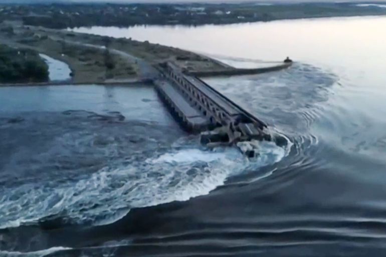 This screen grab from a video posted on Ukraine's President Volodymyr Zelensky's Twitter account on June 6, 2023 shows an aerial view of the dam of the Kakhovka Hydroelectric Power Station after it was partially destroyed. - A Russian-held dam in southern Ukraine was damaged on June 6, with Kyiv and Moscow accusing each other of blowing it up while locals were forced to flee rising waters. (Photo by - / various sources / AFP) / -----EDITORS NOTE --- RESTRICTED TO EDITORIAL USE - MANDATORY CREDIT "AFP PHOTO /TWITTER / ACCOUNT OF UKRAINE'S PRESIDENT VOLODYMYR ZELENSKY @ZELNESKYYUA " - NO MARKETING - NO ADVERTISING CAMPAIGNS - DISTRIBUTED AS A SERVICE TO CLIENTS - -----EDITORS NOTE --- RESTRICTED TO EDITORIAL USE - MANDATORY CREDIT "AFP PHOTO /Twitter / Account of Ukraine's President Volodymyr Zelensky @ZelneskyyUa " - NO MARKETING - NO ADVERTISING CAMPAIGNS - DISTRIBUTED AS A SERVICE TO CLIENTS /