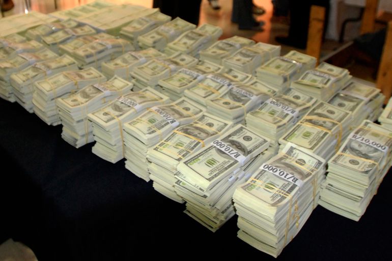 Four million U.S. dollars in counterfeit bills are shown at a police station in Panama City