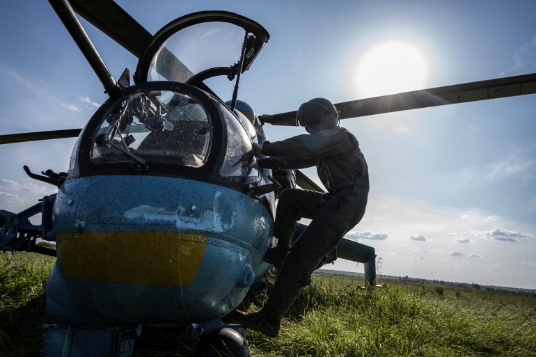 A Ukrainian pilot prepares to take off to carry out a mission in a Mi-24 attack helicopter during military drills Dnipropetrovsk region