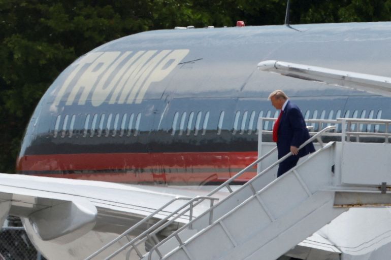 Former U.S. President Donald Trump arrives at Miami International Airport