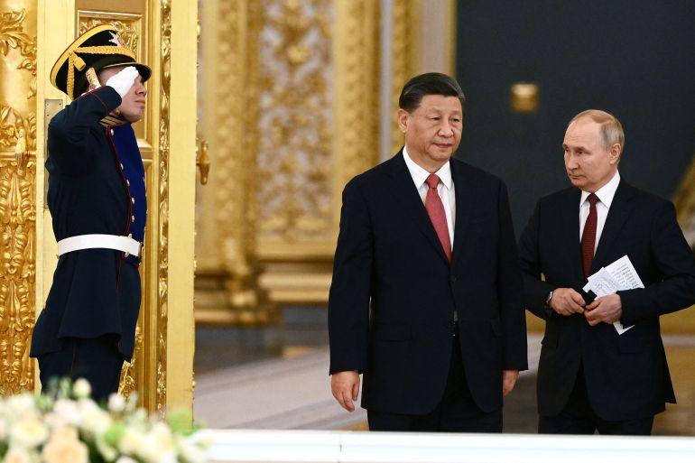 Russian President Vladimir Putin and Chinese President Xi Jinping arrive for Russia-China talks in an expanded format at the Kremlin in Moscow, Russia March 21, 2023. Sputnik/Alexei Maishev/Kremlin via REUTERS ATTENTION EDITORS - THIS IMAGE WAS PROVIDED BY A THIRD PARTY.