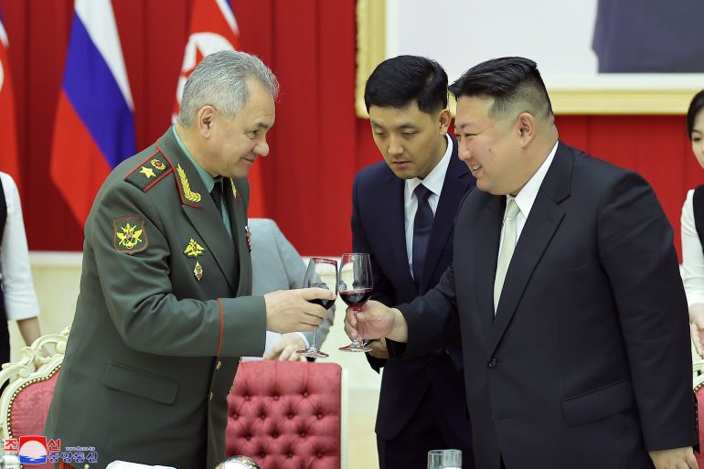 epa10772676 A photo released by the official North Korean Central News Agency (KCNA) shows North Korean Supreme leader Kim Jong-un (C), having a toast with Russian Defense Minister Sergei Shoigu (L) during a reception for the minister and his military delegation in Pyongyang, North Korea, 27 July 2023 (issued 28 July 2023). The delegation visited the North to attend a ceremony to mark the 70th anniversary of the Korean War armistice agreement on 27 July. EPA-EFE/KCNA EDITORIAL USE ONLY