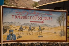 Ouarzazate/ Morocco - july 25 2008: Funny direction sign to show to way to Timbuktu in South Morocco.