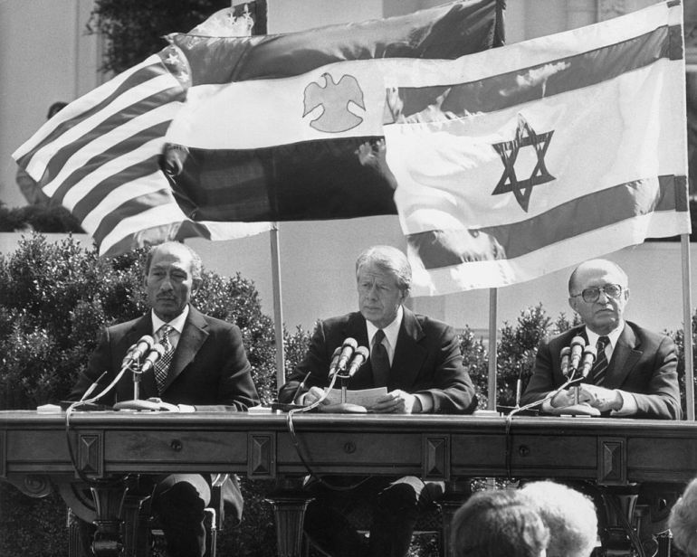 26th March 1979: L-R: Egyptian president Anwar al-Sadat (1918-1981), United States president Jimmy (James Earl) Carter, and Israeli prime minister Menachem Begin (1913 - 1992), preparing to sign the Egypt - Israel peace treaty at a White House ceremony, Washington, D.C.. The agreement marked the end of more than 30 years of hostility between the two nations. (Photo by Consolidated News Pictures/Getty Images)